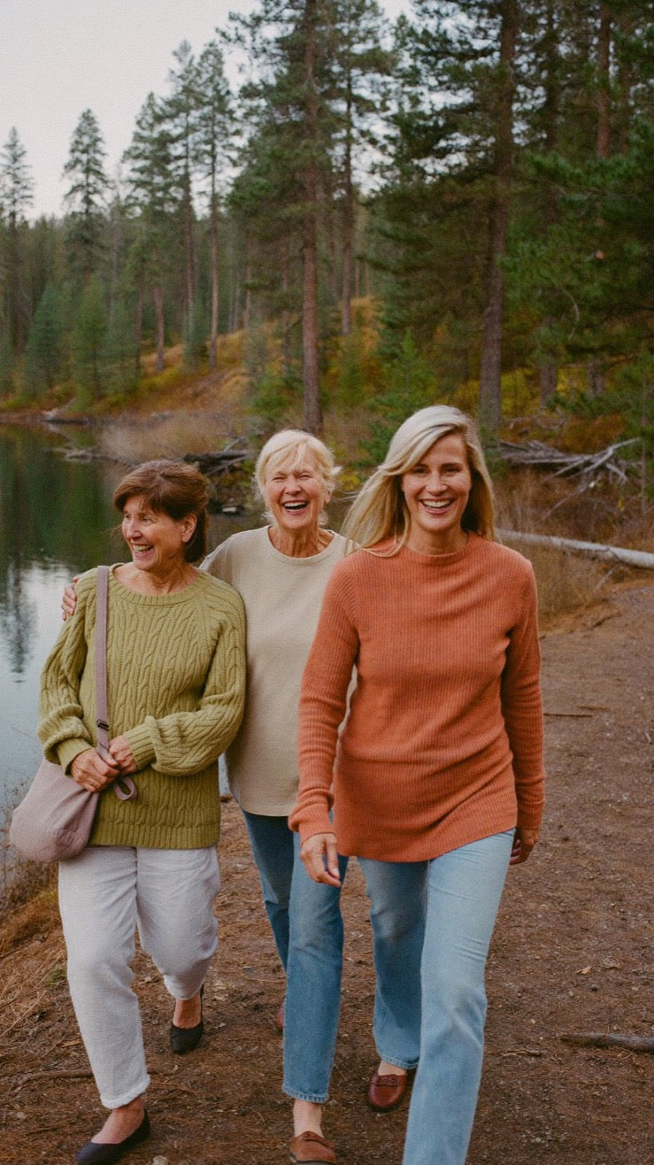 Friends walking a lakeside trail