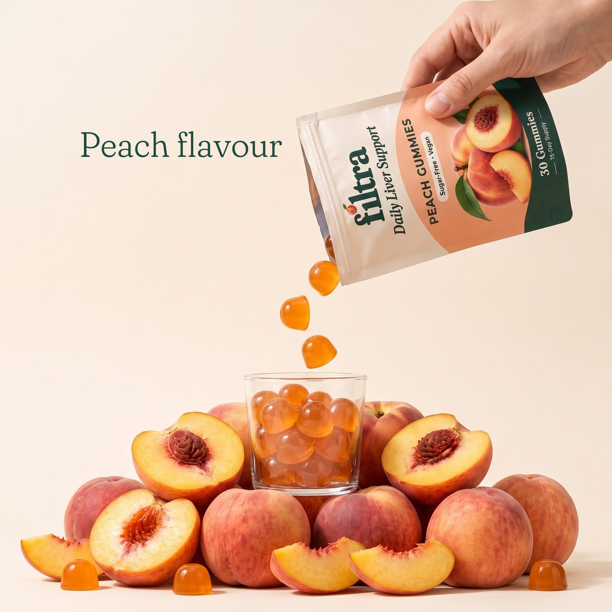 Peach flavour: Filtra gummies pouring from the pouch over fresh peaches